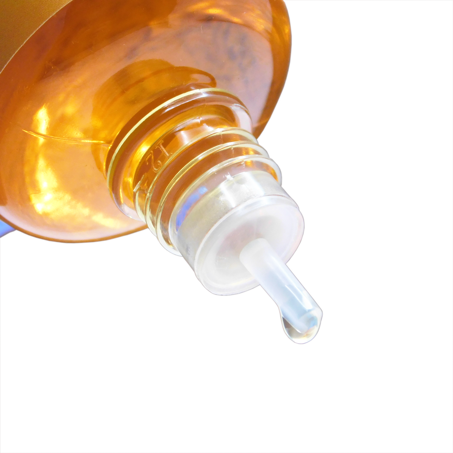 A 50ml bottle of Revolubes Clear Blend bicycle chain lube with a precision applicator.